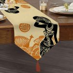 - UcgenRunner-5830-Gorsel1 - Realhomes  Etnik Desen Zeminli Afrika Kadın Motifli Dekoratif Püsküllü Şönil Üçgen Runner Realhomes