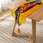 - UcgenRunner-afrika-kadin-Gorsel2 - Realhomes  RealHomes Afrika Kadın Temalı Dijital Baskılı Dekoratif Püsküllü Şönil Üçgen Runner Realhomes