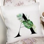 - Rh-K9454-Gorsel2 - Realhomes Beyaz Zemin Yaprak Motifli Siyah A Harfi Özel Tasarım Dijital Baskılı Yastık Kırlent Kılıfı Realhomes