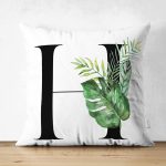 - Suet-K9462-Gorsel1 - Realhomes Beyaz Zemin Yaprak Motifli Siyah H Harfi Özel Tasarım Modern Suet Yastık Kırlent Kılıfı Realhomes