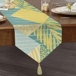 - UcgenRunner-7892-Gorsel1 - Realhomes Realhomes Renkli Zemin Üzerinde Geometrik Desenli Yaprak Motifli Dijital Baskılı Özel Tasarım Püsküllü Şönil Üçgen Runner Realhomes