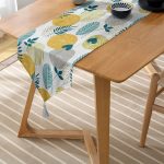 - UcgenRunner-7307-Gorsel-2 - Realhomes  Realhomes Beyaz Zemin Üzerinde Yaprak Desenli Dijital Baskılı Özel Tasarım Püsküllü Şönil Üçgen Runner Realhomes